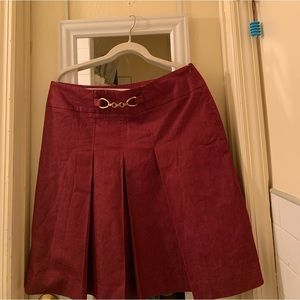 Redish-Burgandy skirt with a little chain in the front